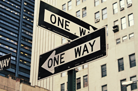 Multiple one-way signs pointing in different directions, representing the different paths a student could take in life.